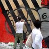 Fairey Mural Still Getting Bombed, Buffed